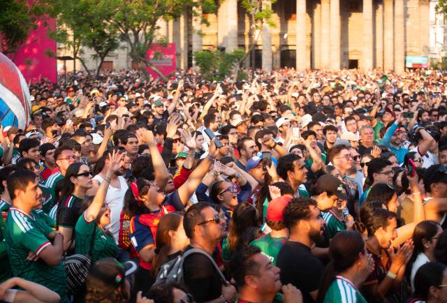 Fans react as they watch the 2026 World Cup Group H football match between Uruguay and Spain on a giant screen at the FIFA Fan Festival, held at Plaza de la Liberacion and Plaza de Armas, in Guadalajara, Mexico, on June 26, 2026. (Photo by RUTH ROSAS / AFP)