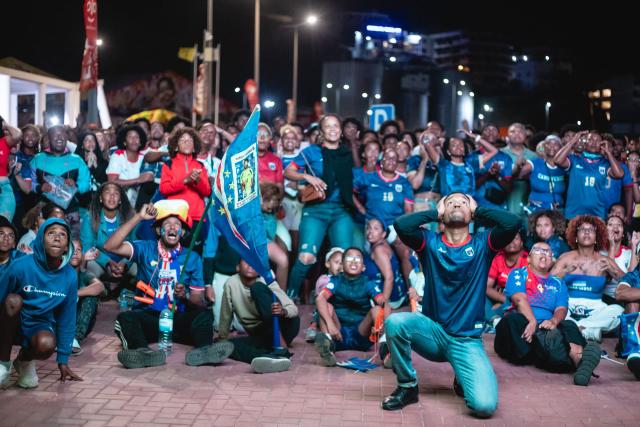 Supporters of Cape Verde's national football team react as they watch the 2026 World Cup football tournament match between Cape Verde and Saudi Arabia in Mindelo, on June 27, 2026. (Photo by Queila Fernandes / AFP)