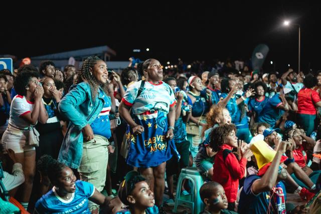 Supporters of Cape Verde's national football team react as they watch the 2026 World Cup football tournament match between Cape Verde and Saudi Arabia in Mindelo, on June 27, 2026. (Photo by Queila Fernandes / AFP)
