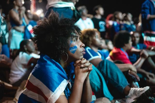A supporter of Cape Verde's national football team reacts as she watches the 2026 World Cup football tournament match between Cape Verde and Saudi Arabia in Mindelo, on June 27, 2026. (Photo by Queila Fernandes / AFP)
