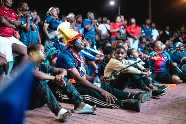 Supporters of Cape Verde's national football team react as they watch the 2026 World Cup football tournament match between Cape Verde and Saudi Arabia in Mindelo, on June 27, 2026. (Photo by Queila Fernandes / AFP)