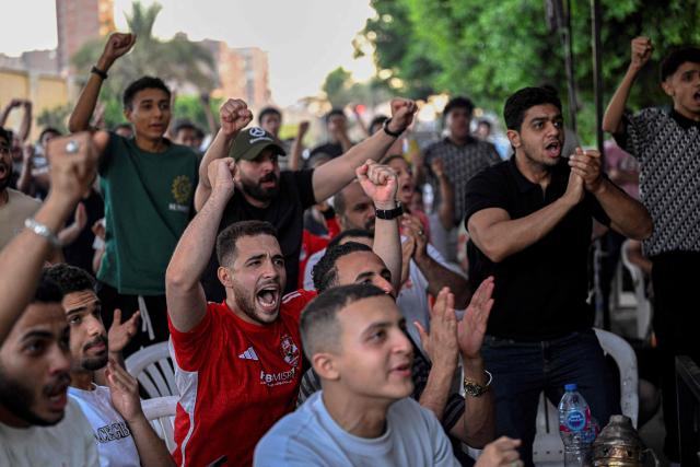 Egyptian football fans react as they watch their national team's 2026 World Cup Group G football match against Iran, at an outdoor cafe in the Sharabiya district of Cairo on June 27, 2026. (Photo by Khaled DESOUKI / AFP)