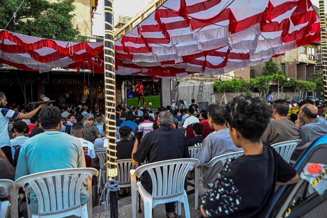 Egyptian football fans watch their national team's 2026 World Cup Group G football match against Iran, at an outdoor cafe in the Sharabiya district of Cairo on June 27, 2026. (Photo by Khaled DESOUKI / AFP)