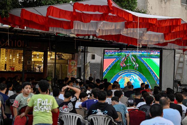 Egyptian football fans watch their national team's 2026 World Cup Group G football match against Iran, at an outdoor cafe in the Sharabiya district of Cairo on June 27, 2026. (Photo by Khaled DESOUKI / AFP)