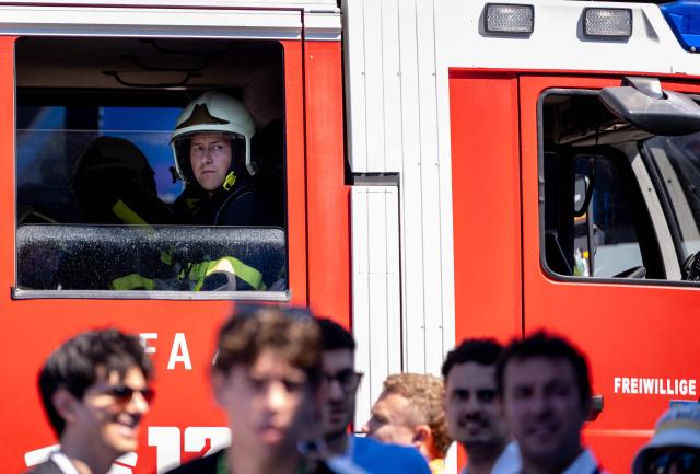 A firefighter waits in a fire engine during a call in the paddock prior to the third practice session at the Red Bull Ring race track in Spielberg, Austria on June 27, 2026, ahead of the Formula One Austrian Grand Prix. (Photo by Joe KLAMAR / AFP)