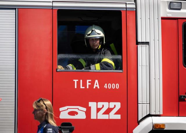A firefighter waits in a fire engine during a call in the paddock prior to the third practice session at the Red Bull Ring race track in Spielberg, Austria on June 27, 2026, ahead of the Formula One Austrian Grand Prix. (Photo by Joe KLAMAR / AFP)