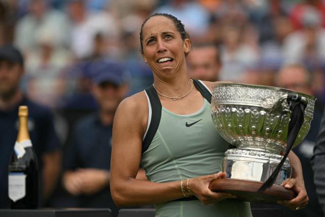 US player Madison Keys reacts as she poses with the trophy after her win over Germany's Tatjana Maria during their women's final tennis match on day six of the Lexus Eastbourne Open at Devonshire Park, Eastbourne, on the south coast of England on June 27, 2026. (Photo by Glyn KIRK / AFP)