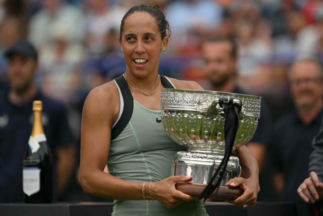US player Madison Keys reacts as she poses with the trophy after her win over Germany's Tatjana Maria during their women's final tennis match on day six of the Lexus Eastbourne Open at Devonshire Park, Eastbourne, on the south coast of England on June 27, 2026. (Photo by Glyn KIRK / AFP)