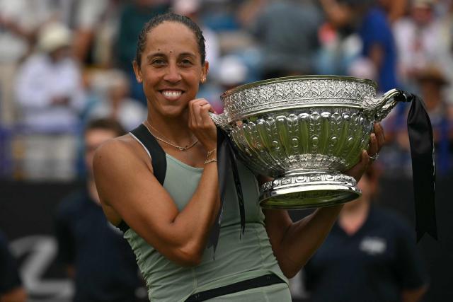 US player Madison Keys poses with the trophy after her win over Germany's Tatjana Maria during their women's final tennis match on day six of the Lexus Eastbourne Open at Devonshire Park, Eastbourne, on the south coast of England on June 27, 2026. (Photo by Glyn KIRK / AFP)