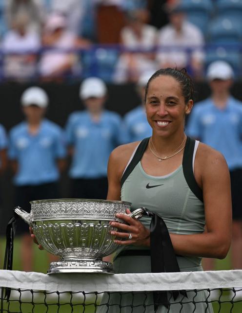 US player Madison Keys poses with the trophy after her win over Germany's Tatjana Maria during their women's final tennis match on day six of the Lexus Eastbourne Open at Devonshire Park, Eastbourne, on the south coast of England on June 27, 2026. (Photo by Glyn KIRK / AFP)