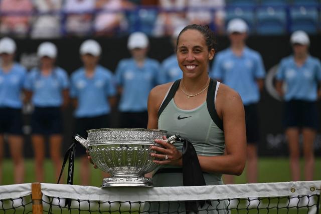 US player Madison Keys poses with the trophy after her win over Germany's Tatjana Maria during their women's final tennis match on day six of the Lexus Eastbourne Open at Devonshire Park, Eastbourne, on the south coast of England on June 27, 2026. (Photo by Glyn KIRK / AFP)