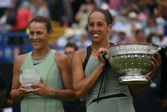 Winners, US player Madison Keys (R) and Germany's Tatjana Maria (L) pose with their trophies after their women's final tennis match on day six of the Lexus Eastbourne Open at Devonshire Park, Eastbourne, on the south coast of England on June 27, 2026. (Photo by Glyn KIRK / AFP)