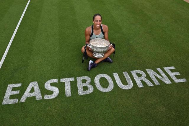 US player Madison Keys poses with the trophy after her win over Germany's Tatjana Maria during their women's final tennis match on day six of the Lexus Eastbourne Open at Devonshire Park, Eastbourne, on the south coast of England on June 27, 2026. (Photo by Glyn KIRK / AFP)