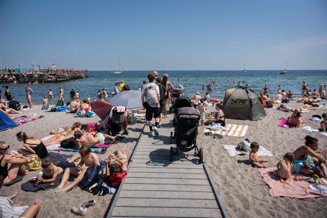 People cool off at Amager Beach in Copenhagen, Denmark on June 27, 2026. Denmark recorded its highest temperature on record on June 27, 2026, the Danish Meteorological Institute (DMI) said.
"With 36.6C north of Odense, we have the warmest day ever since measurements began in 1874," DMI said in a post to X. (Photo by Emil Nicolai Helms / Ritzau Scanpix / AFP) / Denmark OUT