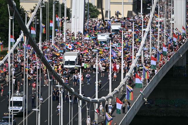 Participants march on the Elisabeth bridge as they take part in the Budapest Pride Parade in Budapest, Hungary on June 27, 2026. (Photo by Attila KISBENEDEK / AFP)