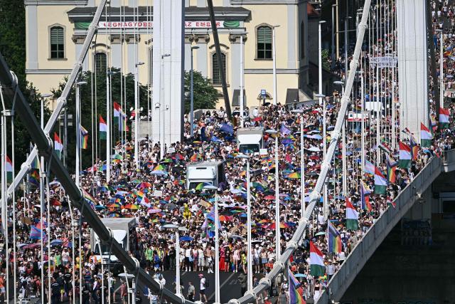 Participants march on the Elisabeth bridge as they take part in the Budapest Pride Parade in Budapest, Hungary on June 27, 2026. (Photo by Attila KISBENEDEK / AFP)
