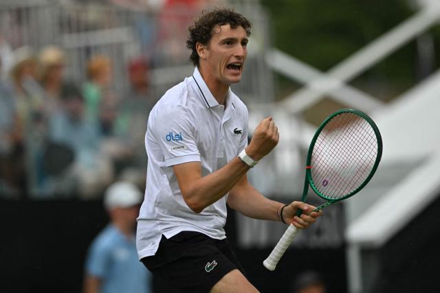 France's Ugo Humbert reacts while playing Belgium's Zizou Bergs during their men's final tennis match on day six of the Lexus Eastbourne Open at Devonshire Park, Eastbourne, on the south coast of England on June 27, 2026. (Photo by Glyn KIRK / AFP)