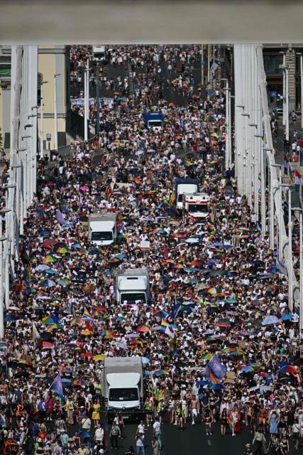 Participants march on the Elisabeth bridge as they take part in the Budapest Pride Parade in Budapest, Hungary on June 27, 2026. (Photo by Attila KISBENEDEK / AFP)