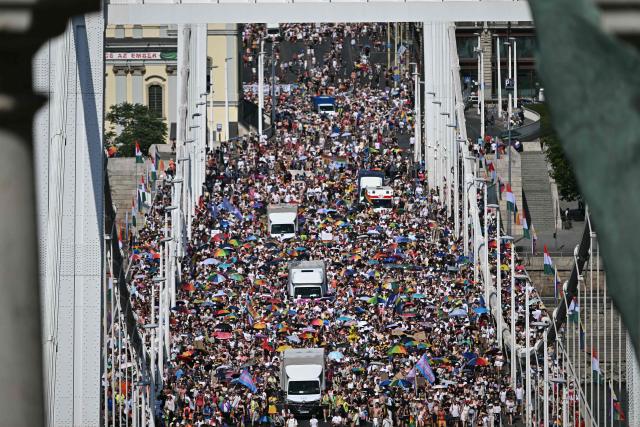 Participants march on the Elisabeth bridge as they take part in the Budapest Pride Parade in Budapest, Hungary on June 27, 2026. (Photo by Attila KISBENEDEK / AFP)