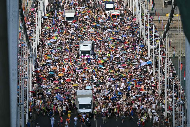 Participants march on the Elisabeth bridge as they take part in the Budapest Pride Parade in Budapest, Hungary on June 27, 2026. (Photo by Attila KISBENEDEK / AFP)