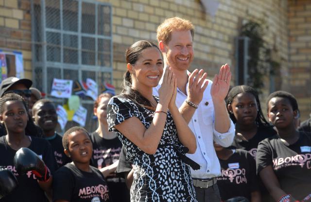 (FILES) Britain's Prince Harry, Duke of Sussex and Meghan, Duchess of Sussex arrive for a visit to the "Justice desk", an NGO in the township of Nyanga in Cape Town, as they begin their tour of the region on September 23, 2019. Prince Harry, his wife Meghan and two children will stay at royal residences during their first family trip back to the UK in four years in July, a source familiar with the matter said on June 27, 2026. (Photo by Courtney AFRICA / POOL / AFP)