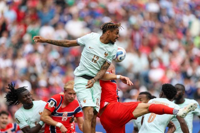 France's forward #12 Bradley Barcola jumps to head the ball during the 2026 World Cup Group I football match between Norway and France at the Boston Stadium in Foxborough on June 26, 2026.  (Photo by FRANCK FIFE / AFP)