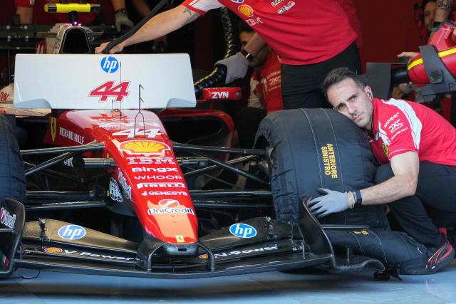 Ferrari engineers work on Ferrari's British driver Lewis Hamilton's car during the qualifying session at the Red Bull Ring race track in Spielberg, Austria on June 27, 2026, ahead of the Formula One Austrian Grand Prix. (Photo by Darko Bandic / POOL / AFP)