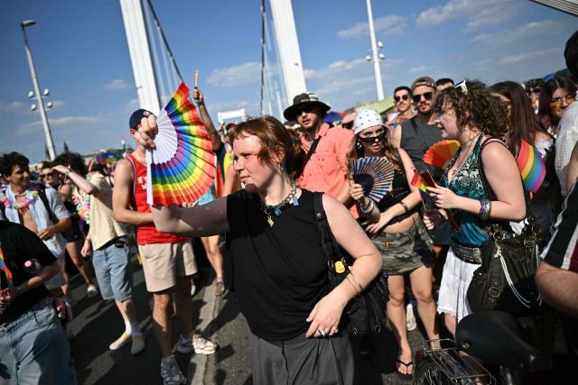 Participants in the Budapest Pride Parade, march across the Elisabeth bridge in Budapest, Hungary on June 27, 2026. (Photo by Attila KISBENEDEK / AFP)
