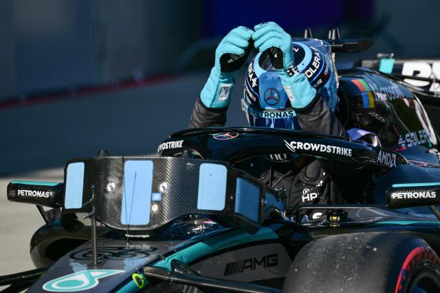 Mercedes' British driver George Russell gets out of his car to celebrate his Pole position after the qualifying session at the Red Bull Ring race track in Spielberg, Austria on June 27, 2026, ahead of the Formula One Austrian Grand Prix. (Photo by Andrej ISAKOVIC / AFP)
