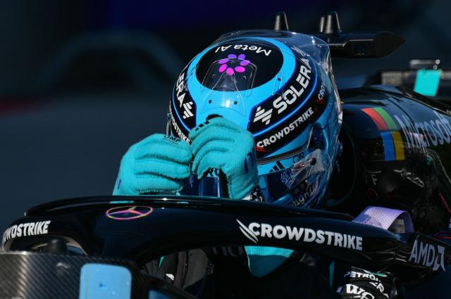 Mercedes' British driver George Russell gets out of his car to celebrate his Pole position after the qualifying session at the Red Bull Ring race track in Spielberg, Austria on June 27, 2026, ahead of the Formula One Austrian Grand Prix. (Photo by Andrej ISAKOVIC / AFP)