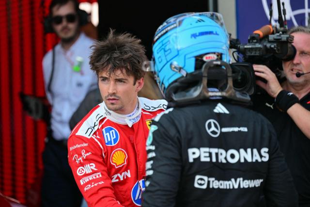 Ferrari's Monegasque driver Charles Leclerc (L) is pictured next to Mercedes' British driver George Russell after the qualifying session at the Red Bull Ring race track in Spielberg, Austria on June 27, 2026, ahead of the Formula One Austrian Grand Prix. (Photo by Andrej ISAKOVIC / AFP)