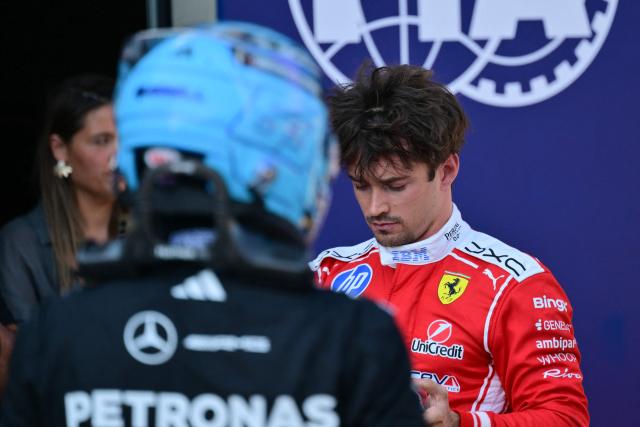 Ferrari's Monegasque driver Charles Leclerc (R) is pictured next to Mercedes' British driver George Russell after the qualifying session at the Red Bull Ring race track in Spielberg, Austria on June 27, 2026, ahead of the Formula One Austrian Grand Prix. (Photo by Andrej ISAKOVIC / AFP)
