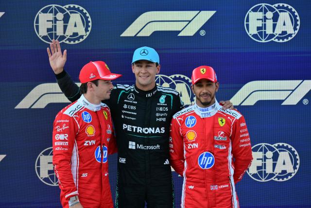 Pole position winner Mercedes' British driver George Russell (C) poses with second placed Ferrari's Monegasque driver Charles Leclerc (L) and third placed Ferrari's British driver Lewis Hamilton (R) after the qualifying session at the Red Bull Ring race track in Spielberg, Austria on June 27, 2026, ahead of the Formula One Austrian Grand Prix. (Photo by Andrej ISAKOVIC / AFP)