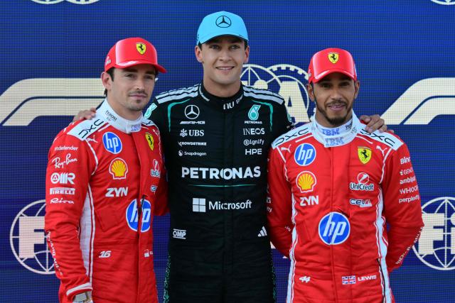Pole position winner Mercedes' British driver George Russell (C) poses with second placed Ferrari's Monegasque driver Charles Leclerc (L) and third placed Ferrari's British driver Lewis Hamilton (R) after the qualifying session at the Red Bull Ring race track in Spielberg, Austria on June 27, 2026, ahead of the Formula One Austrian Grand Prix. (Photo by Andrej ISAKOVIC / AFP)