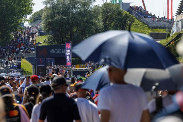 Fans brave the heat at the Red Bull Ring race track in Spielberg, Austria on June 27, 2026, ahead of the Formula One Austrian Grand Prix. (Photo by ERWIN SCHERIAU / APA / AFP) / Austria OUT