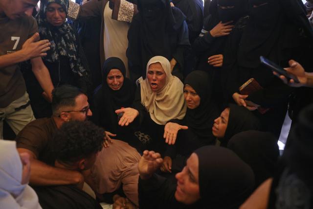 Mourners attend the funeral of 15-year-old Islam Moussa and her brother Abdallah, who were both reportedly killed in an Israeli airstrike, in Khan Yunis in the souhthern Gaza Strip on June 27, 2026. A ceasefire has been in place in Gaza since October, but Israel reserves the right to strike targets it deems a threat. The territory remains gripped by daily violence as Israeli strikes continue, with both the military and Hamas accusing one another of violating the truce. (Photo by Bashar Taleb / AFP)