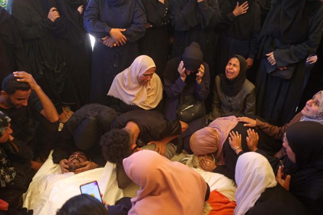 EDITORS NOTE: Graphic content / Mourners attend the funeral of 15-year-old Islam Moussa and her brother Abdallah, who were both reportedly killed in an Israeli airstrike, in Khan Yunis in the souhthern Gaza Strip on June 27, 2026. A ceasefire has been in place in Gaza since October, but Israel reserves the right to strike targets it deems a threat. The territory remains gripped by daily violence as Israeli strikes continue, with both the military and Hamas accusing one another of violating the truce. (Photo by Bashar Taleb / AFP)