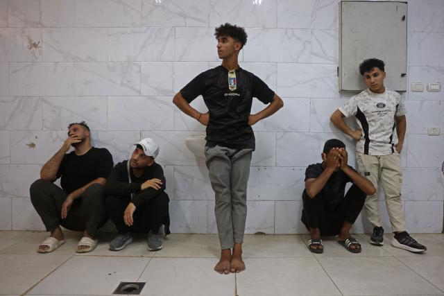 Mourners attend the funeral of 15-year-old Islam Moussa and her brother Abdallah, who were both reportedly killed in an Israeli airstrike, in Khan Yunis in the souhthern Gaza Strip on June 27, 2026. A ceasefire has been in place in Gaza since October, but Israel reserves the right to strike targets it deems a threat. The territory remains gripped by daily violence as Israeli strikes continue, with both the military and Hamas accusing one another of violating the truce. (Photo by Bashar Taleb / AFP)