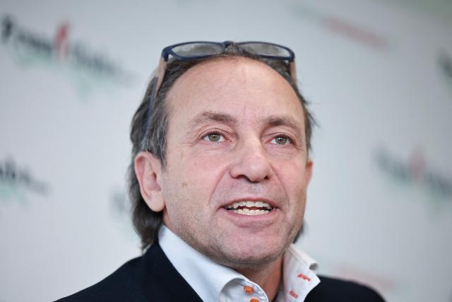 (FILES) French former Olympic figure skater Philippe Candeloro addresses media during a press conference, in Issy-Les-Moulineaux, in the outskirts of Paris on January 13, 2026. Former figure skater Philippe Candeloro was elected president of the French Ice Sports Federation on June 27, 2026, defeating outgoing president Gwenaëlle Noury in the second round, AFP learned from sources familiar with the matter. (Photo by Anne-Christine POUJOULAT / AFP)