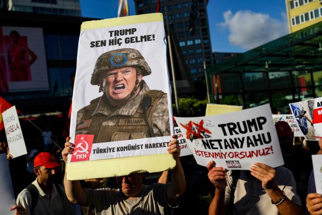 A protester holds a placard featuring US President Donald Trump during a leftist anti-NATO demonstration in Istanbul, ahead of the NATO summit in Ankara on June 27, 2026. The NATO summit takes place in Ankara on July 7-8. (Photo by Yasin AKGUL / AFP)