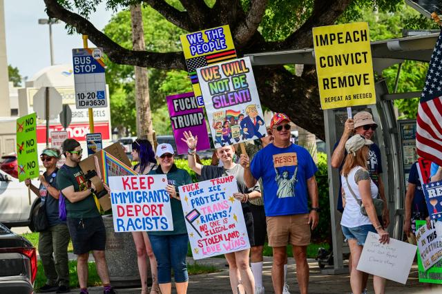 People participate in the "All of US" demonstration in Wilton Manors, Florida, on June 27, 2026. Activists are conducting a nationwide response to the planned events by the administration of US President Donald Trump to mark the 250th anniversary of the United States' Declaration of Independence. (Photo by GIORGIO VIERA / AFP)