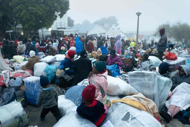 Hundreds of Zimbabwean migrants gather with their belongings outside the Zimbabwean Consulate in Cape Town, on June 27, 2026, as they try to get repatriated to Zimbabwe. South Africans President Cyril Ramaphosa vowed on Thursday to crush any attempts to destabilise the nation during planned anti-immigrant marches next week, amid a wave of xenophobia. Citizen-led groups have set Tuesday 30 as a deadline for undocumented foreigners to leave and called for nationwide marches against illegal immigration, marking a crescendo in months of protests that have at times turned violent. (Photo by RODGER BOSCH / AFP)
