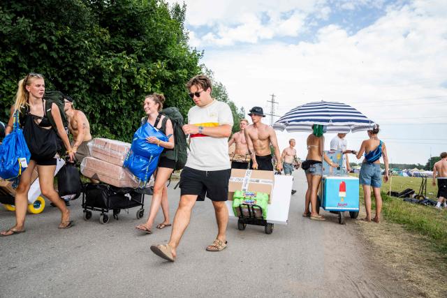 People arrive as the camping area opens at the Roskilde Festival, on June 27, 2026, ahead of the July 1st start of the Roskilde Festival. Denmark recorded its highest temperature on record on June 27, 2026, the Danish Meteorological Institute (DMI) said.
"With 36.6C north of Odense, we have the warmest day ever since measurements began in 1874," DMI said in a post to X. (Photo by Ida Marie Odgaard / Ritzau Scanpix / AFP) / Denmark OUT