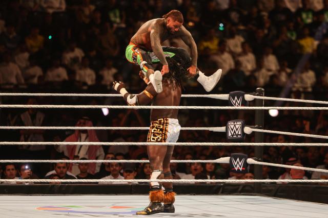 Nigerian wrestler Oba Femi and US wrestler Jey Uso (top) fight during the WWE Night of Champions wrestling event in Riyadh on June 27, 2026. (Photo by Fayez NURELDINE / AFP)