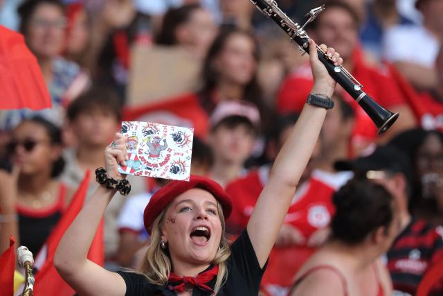 A Stade Toulousain's supporter cheers her team prior to the French Top 14 rugby union final between Stade Toulousain (Toulouse) and Montpellier Hérault Rugby (MHR) at the Stade de France in Saint-Denis, on the outskirst of Paris, on June 27, 2026. (Photo by Kenzo TRIBOUILLARD / AFP)