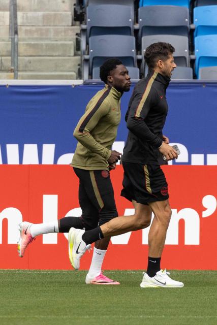 Canada's defender #19 Alphonso Davies (L) takes part in an MD-1 training session at Carson Sports Park in Carson on June 27, 2026, on the eve of the 2026 World Cup round of 32 football match between South Africa and Canada at the Los Angeles Stadium in Inglewood. (Photo by ETIENNE LAURENT / AFP)