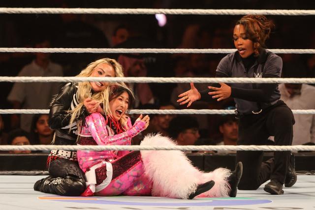 US wrestler Liv "XOXO" Morgan (L) and Japanese wrestler Iyo Sky fight during the WWE Night of Champions wrestling event in Riyadh on June 27, 2026.  (Photo by Fayez NURELDINE / AFP)