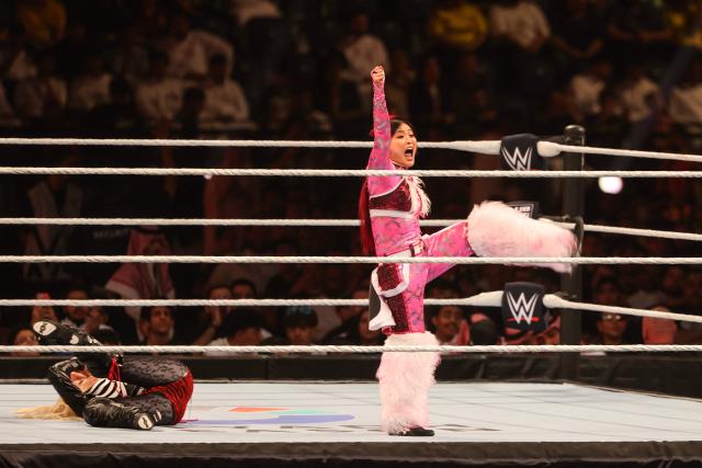 US wrestler Liv "XOXO" Morgan (L) and Japanese wrestler Iyo Sky fight during the WWE Night of Champions wrestling event in Riyadh on June 27, 2026.  (Photo by Fayez NURELDINE / AFP)