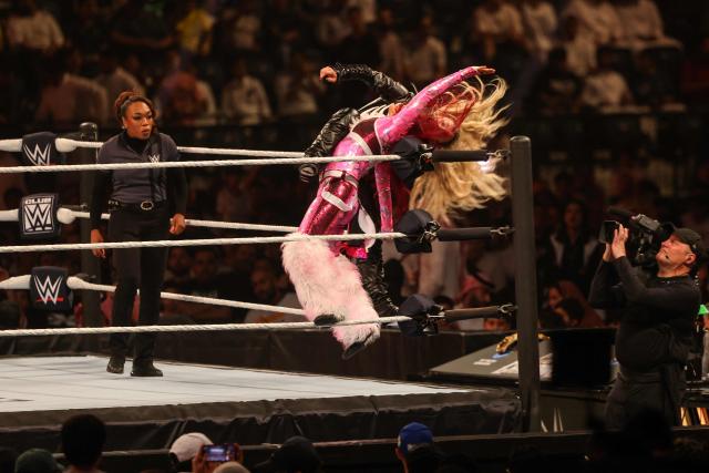 US wrestler Liv "XOXO" Morgan (front) and Japanese wrestler Iyo Sky fight during the WWE Night of Champions wrestling event in Riyadh on June 27, 2026.  (Photo by Fayez NURELDINE / AFP)