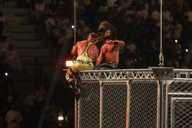 US wrestler Seth Rollins (right) and US wrestler Bron Breakker fight during the WWE Night of Champions wrestling event in Riyadh on June 27, 2026.  (Photo by Fayez NURELDINE / AFP)